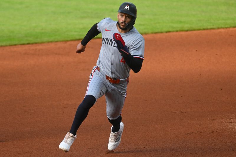 Apr 28, 2025; Cleveland, Ohio, USA; Minnesota Twins shortstop Carlos Correa (4) runs the bases in the first inning against the Cleveland Guardians at Progressive Field. Mandatory Credit: David Richard-Imagn Images