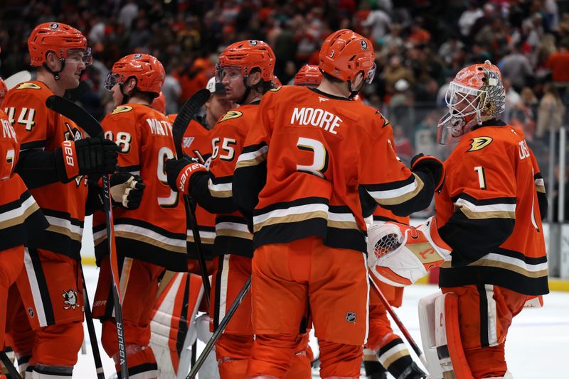 Mar 6, 2026; Anaheim, California, USA;  Anaheim Ducks goaltender Lukas Dostal (1) celebrates with defenseman Ian Moore (3) after defeating the Montreal Canadiens in a shootout at Honda Center. Mandatory Credit: Kiyoshi Mio-Imagn Images