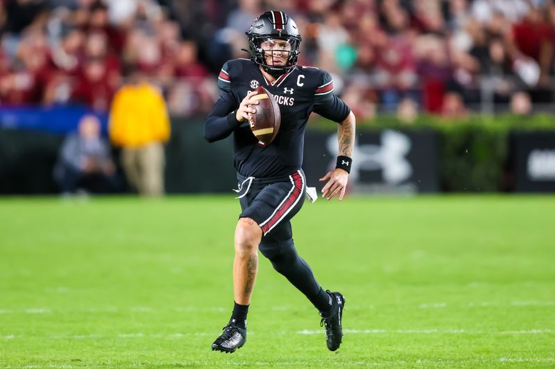 Nov 18, 2023; Columbia, South Carolina, USA; South Carolina Gamecocks quarterback Spencer Rattler (7) scrambles against the Kentucky Wildcats in the first quarter at Williams-Brice Stadium. Mandatory Credit: Jeff Blake-USA TODAY Sports Kentucky