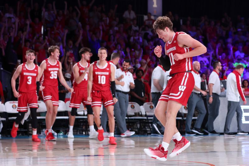 Nov 23, 2022; Paradise Island, BAHAMAS; Wisconsin Badgers guard Max Klesmit (11) reacts during the second half against the Dayton Flyers at Imperial Arena. Mandatory Credit: Kevin Jairaj-USA TODAY Sports