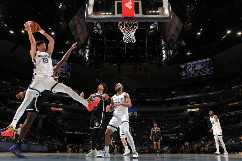 MEMPHIS, TN - February 26:  Yuta Watanabe #18 of the Memphis Grizzlies grabs a rebound during the game against the Brooklyn Nets on February 26, 2024 at FedExForum in Memphis, Tennessee. NOTE TO USER: User expressly acknowledges and agrees that, by downloading and or using this photograph, User is consenting to the terms and conditions of the Getty Images License Agreement. Mandatory Copyright Notice: Copyright 2024 NBAE (Photo by Joe Murphy/NBAE via Getty Images)