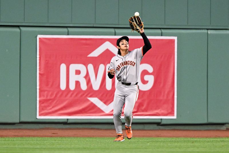 Apr 30, 2024; Boston, Massachusetts, USA; San Francisco Giants center fielder Jung Hoo Lee (51) makes a catch for an out against the Boston Red Sox during the third inning at Fenway Park. Mandatory Credit: Brian Fluharty-USA TODAY Sports