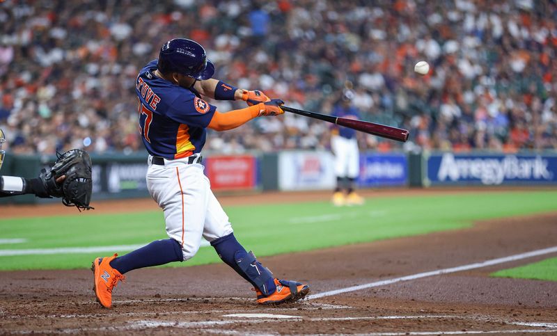 Sep 10, 2023; Houston, Texas, USA; Houston Astros second baseman Jose Altuve (27) hits a home run during the third inning against the San Diego Padres at Minute Maid Park. Mandatory Credit: Troy Taormina-USA TODAY Sports