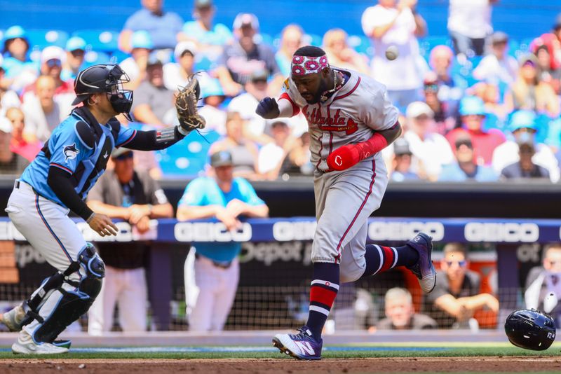 Apr 14, 2024; Miami, Florida, USA; Atlanta Braves center fielder Michael Harris II (23) scores against the Miami Marlins during the fourth inning at loanDepot Park. Mandatory Credit: Sam Navarro-USA TODAY Sports