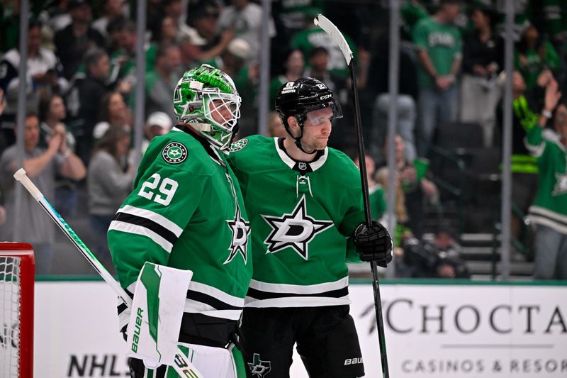 Oct 14, 2025; Dallas, Texas, USA; Dallas Stars goaltender Jake Oettinger (29) and center Radek Faksa (12) celebrate the win over the Minnesota Wild at the American Airlines Center. Mandatory Credit: Jerome Miron-Imagn Images
