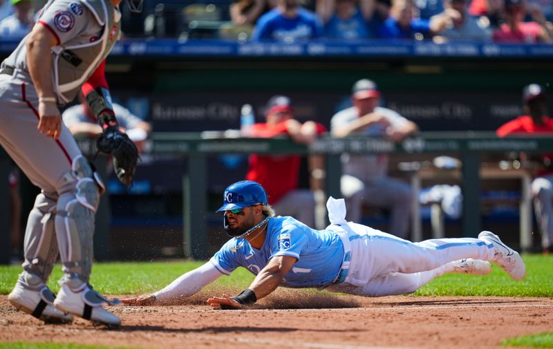 May 28, 2023; Kansas City, Missouri, USA; Kansas City Royals right fielder MJ Melendez (1) slides into home to score the winning run ahead of the throw to Washington Nationals catcher Riley Adams (15) during the ninth inning at Kauffman Stadium. Mandatory Credit: Jay Biggerstaff-USA TODAY Sports