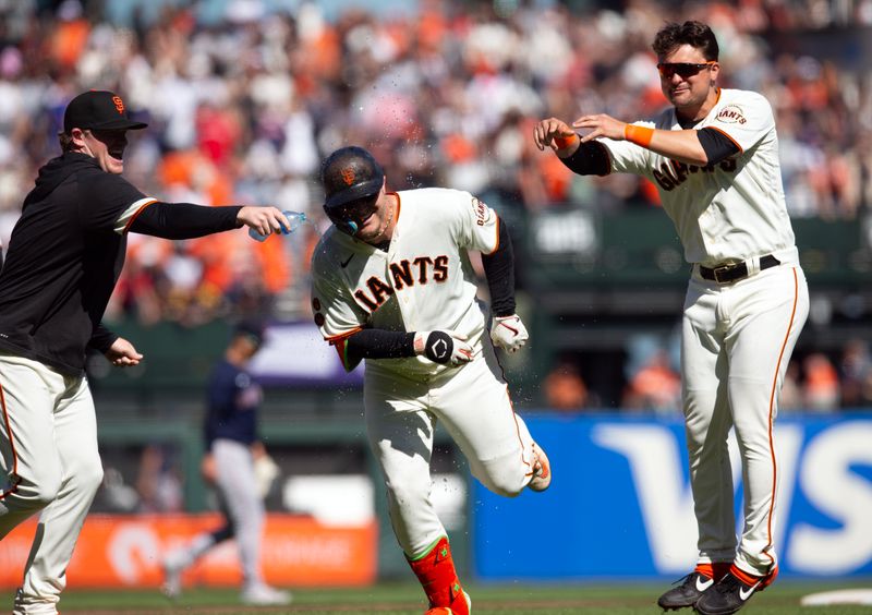 Jul 30, 2023; San Francisco, California, USA; San Francisco Giants left fielder Joc Pederson (center) ducks away from his teammates as they mob him after his game-winning single against the Boston Red Sox during the 11th inning at Oracle Park. Mandatory Credit: D. Ross Cameron-USA TODAY Sports