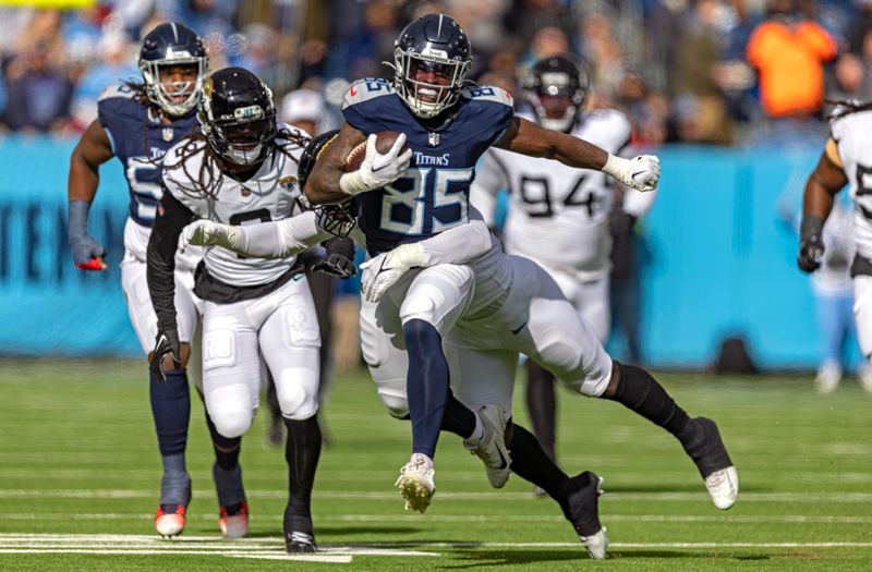 Tennessee Titans tight end Chigoziem Okonkwo (85) runs for yardage during their NFL football game against the Jacksonville Jaguars Sunday, Jan. 7, 2024, in Nashville, Tenn. (AP Photo/Wade Payne)