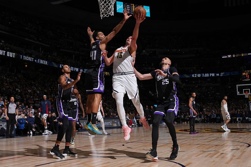 DENVER, CO - FEBRUARY 28: Nikola Jokic #15 of the Denver Nuggets drives to the basket during the game against the Sacramento Kings on February 28, 2024 at the Ball Arena in Denver, Colorado. NOTE TO USER: User expressly acknowledges and agrees that, by downloading and/or using this Photograph, user is consenting to the terms and conditions of the Getty Images License Agreement. Mandatory Copyright Notice: Copyright 2024 NBAE (Photo by Garrett Ellwood/NBAE via Getty Images)