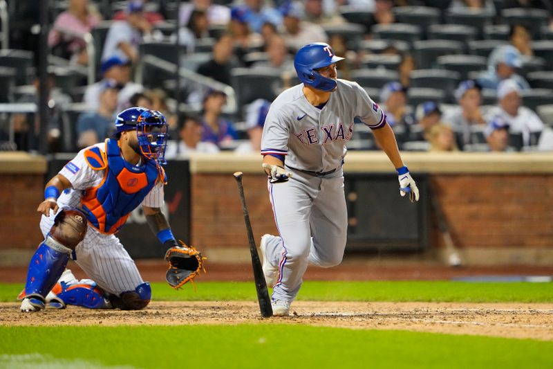 Aug 30, 2023; New York City, New York, USA;  Texas Rangers shortstop Corey Seager (5) hits a single against the New York Mets during the eighth inning at Citi Field. Mandatory Credit: Gregory Fisher-USA TODAY Sports