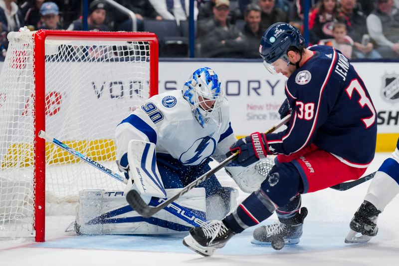 Nov 2, 2023; Columbus, Ohio, USA;  Tampa Bay Lightning goaltender Matt Tomkins (90) defends the net against Columbus Blue Jackets center Boone Jenner (38) in the third period at Nationwide Arena. Mandatory Credit: Aaron Doster-USA TODAY Sports