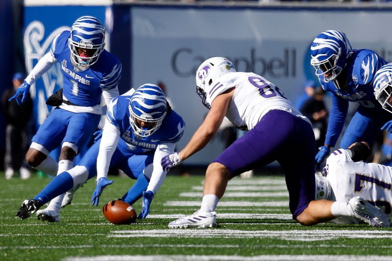 Nov 19, 2022; Memphis, Tennessee, USA; Memphis Tigers defensive back Joel Williams (41) picks up a fumble during the first half against the North Alabama Lions at Simmons Bank Liberty Stadium. Mandatory Credit: Petre Thomas-USA TODAY Sports