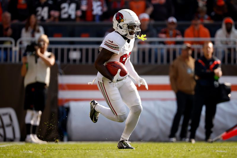 Arizona Cardinals wide receiver Greg Dortch (83) returns a kick during an NFL football game against the Cleveland Browns, Sunday, Nov. 5, 2023, in Cleveland. (AP Photo/Kirk Irwin)