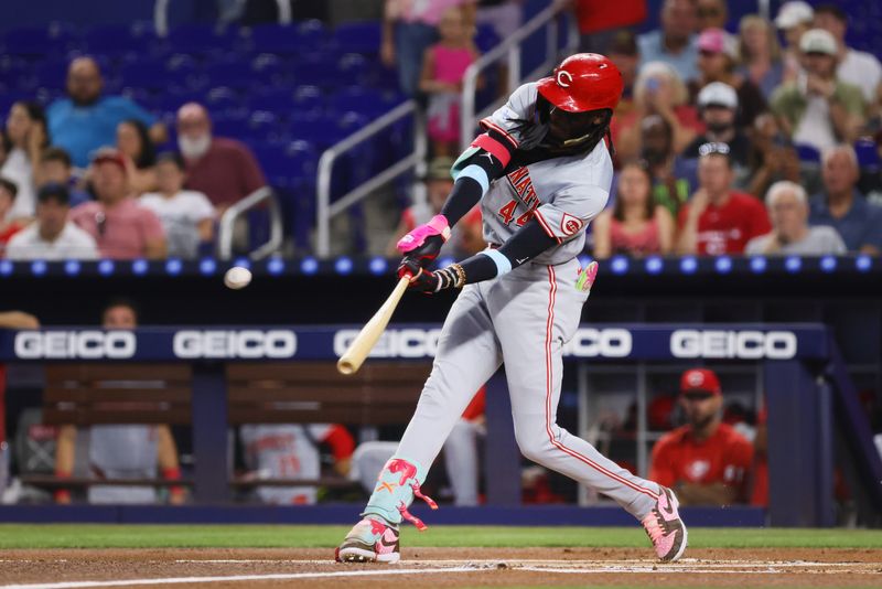 Aug 5, 2024; Miami, Florida, USA; Cincinnati Reds shortstop Elly De La Cruz (44) hits a two-run home run against the Miami Marlins during the first inning at loanDepot Park. Mandatory Credit: Sam Navarro-USA TODAY Sports