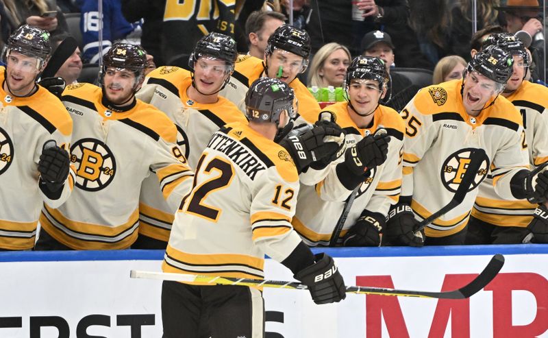 Dec 2, 2023; Toronto, Ontario, CAN; Boston Bruins forward Kevin Shattenkirk (12) celebrates after scoring a goal against the Toronto Maple Leafs in the second period at Scotiabank Arena. Mandatory Credit: Dan Hamilton-USA TODAY Sports