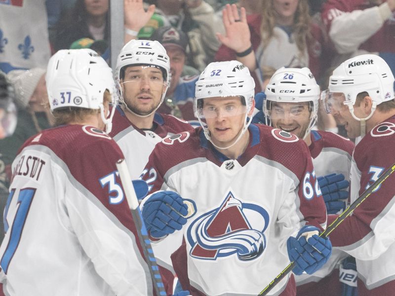 Apr 4, 2024; Saint Paul, Minnesota, USA; Colorado Avalanche left wing Artturi Lehkonen (62) is congratulated by teammates after scoring on the Minnesota Wild in the first period at Xcel Energy Center. Mandatory Credit: Matt Blewett-USA TODAY Sports