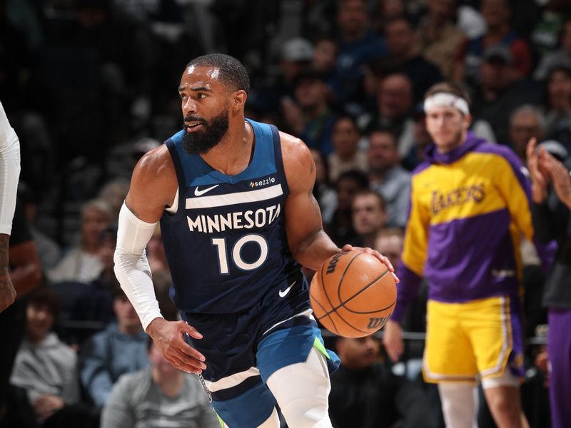 MINNEAPOLIS, MN -  DECEMBER 13:  Mike Conley #10 of the Minnesota Timberwolves dribbles the ball during the game against the Los Angeles Lakers on December 13, 2024 at Target Center in Minneapolis, Minnesota. NOTE TO USER: User expressly acknowledges and agrees that, by downloading and or using this Photograph, user is consenting to the terms and conditions of the Getty Images License Agreement. Mandatory Copyright Notice: Copyright 2024 NBAE (Photo by David Sherman/NBAE via Getty Images)