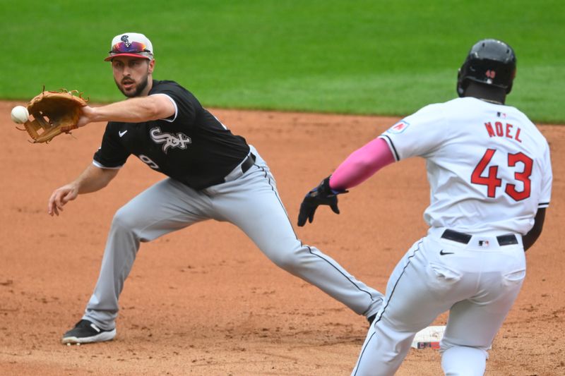 Jul 4, 2024; Cleveland, Ohio, USA; Chicago White Sox shortstop Paul DeJong (29) catches the ball to force out Cleveland Guardians right fielder Jhonkensy Noel (43) in the fifth inning at Progressive Field. Mandatory Credit: David Richard-USA TODAY Sports