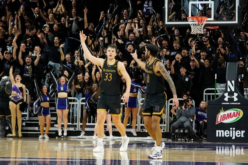 Dec 1, 2023; Evanston, Illinois, USA; Northwestern Wildcats forward Luke Hunger (33) celebrates his three point basket against the Purdue Boilermakers with guard Boo Buie (0)during the second half at Welsh-Ryan Arena. Mandatory Credit: David Banks-USA TODAY Sports