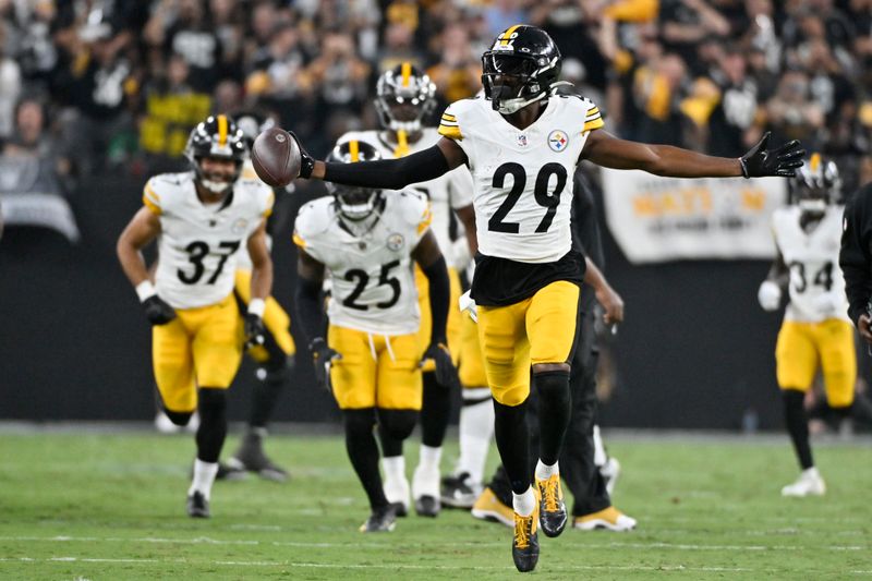 Pittsburgh Steelers cornerback Levi Wallace (29) celebrates after intercepting a pass against the Las Vegas Raiders during the first half of an NFL football game Sunday, Sept. 24, 2023, in Las Vegas. (AP Photo/David Becker)