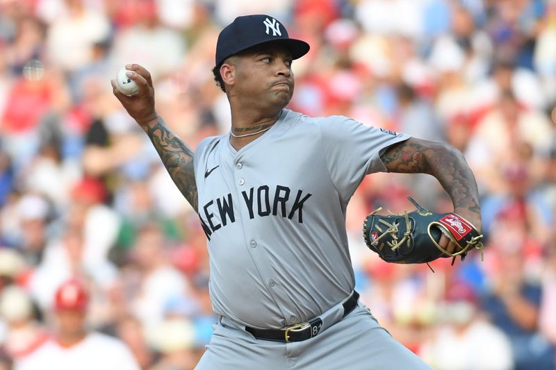 Jul 29, 2024; Philadelphia, Pennsylvania, USA; New York Yankees pitcher Luis Gil (81) throws a pitch against the Philadelphia Phillies during the first inning at Citizens Bank Park. Mandatory Credit: Eric Hartline-USA TODAY Sports