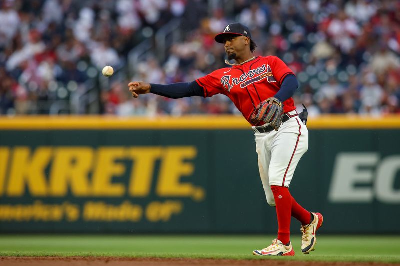 May 5, 2023; Atlanta, Georgia, USA; Atlanta Braves second baseman Ozzie Albies (1) throws a runner out at first against the Baltimore Orioles in the second inning at Truist Park. Mandatory Credit: Brett Davis-USA TODAY Sports