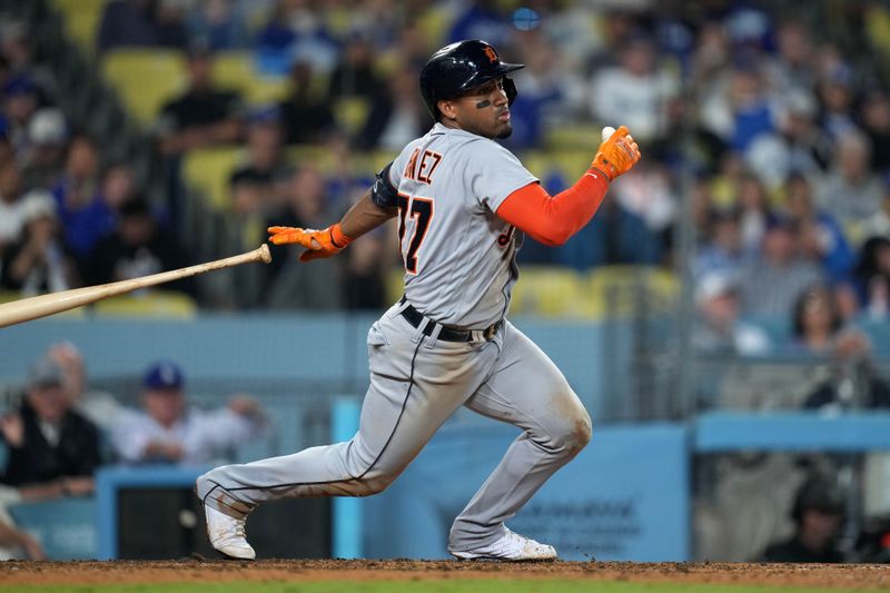 Sep 20, 2023; Los Angeles, California, USA; Detroit Tigers second baseman Andy Ibanez (77) hits a run-scoring single in the seventh inning against the Los Angeles Dodgers at Dodger Stadium. Mandatory Credit: Kirby Lee-USA TODAY Sports