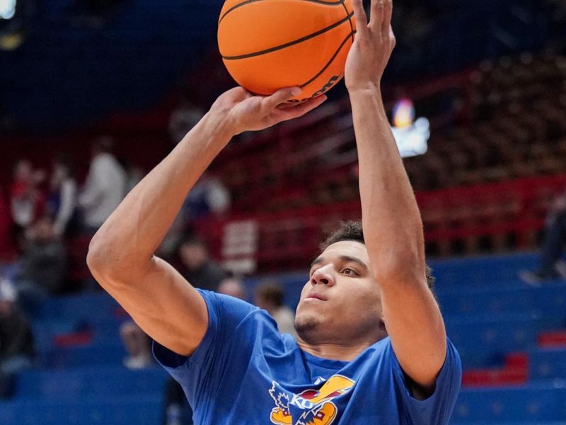 Dec 22, 2023; Lawrence, Kansas, USA; Kansas Jayhawks guard Kevin McCullar Jr. (15) warms up against the Yale Bulldogs prior to a game at Allen Fieldhouse. Mandatory Credit: Denny Medley-USA TODAY Sports