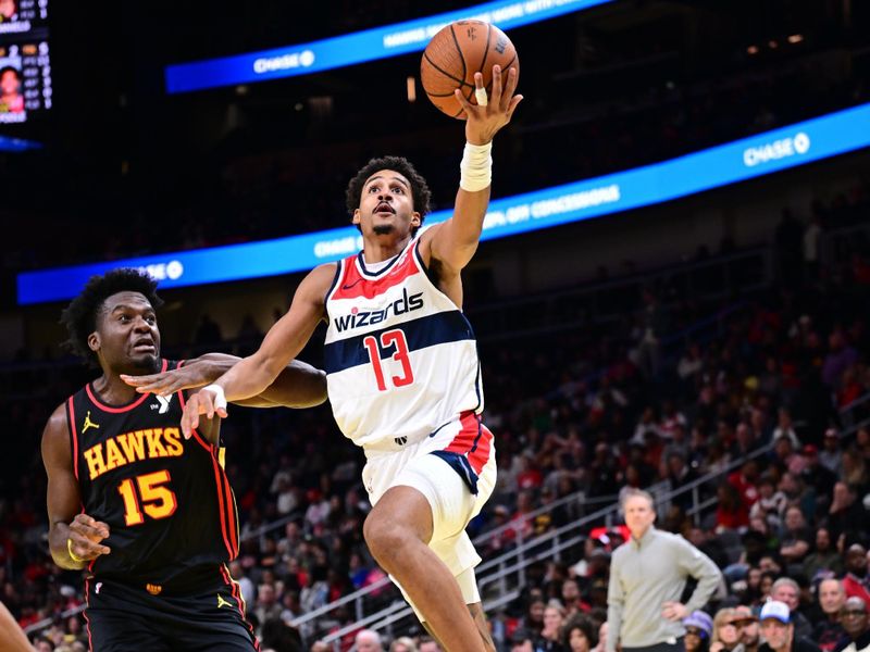 ATLANTA, GA - NOVEMBER 15: Jordan Poole #13 of the Washington Wizards shoots the ball during the game against the Atlanta Hawks  during the Emirates NBA Cup game on November 15, 2024 at State Farm Arena in Atlanta, Georgia.  NOTE TO USER: User expressly acknowledges and agrees that, by downloading and/or using this Photograph, user is consenting to the terms and conditions of the Getty Images License Agreement. Mandatory Copyright Notice: Copyright 2024 NBAE (Photo by Adam Hagy/NBAE via Getty Images)