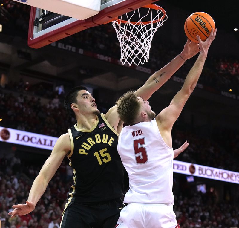 Feb 4, 2024; Madison, Wisconsin, USA; Purdue center Zach Edey (15) blocks a shot by Wisconsin forward Tyler Wahl (5) during the second half at Kohl Center. Mandatory Credit: Mark Hoffman-USA TODAY Sports