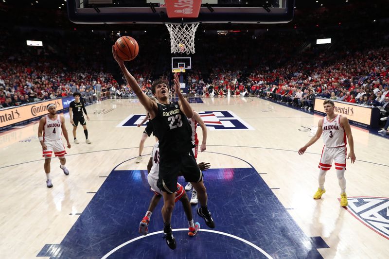 Feb 18, 2023; Tucson, Arizona, USA; Colorado Buffaloes forward Tristan da Silva (23) makes a basket against Arizona Wildcats guard Kylan Boswell (4), and guard Pelle Larsson (3) during the second half at McKale Center. Mandatory Credit: Zachary BonDurant-USA TODAY Sports