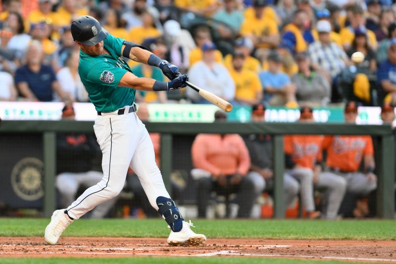 Aug 12, 2023; Seattle, Washington, USA; Seattle Mariners shortstop Dylan Moore (25) hits a double against the Baltimore Orioles during the third inning at T-Mobile Park. Mandatory Credit: Steven Bisig-USA TODAY Sports