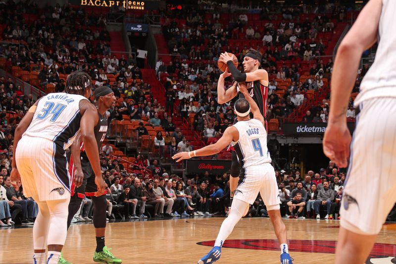 MIAMI, FL - FEBRUARY 6: Tyler Herro #14 of the Miami Heat looks to pass the ball during the game against the Orlando Magic on February 6, 2024 at Kaseya Center in Miami, Florida. NOTE TO USER: User expressly acknowledges and agrees that, by downloading and or using this Photograph, user is consenting to the terms and conditions of the Getty Images License Agreement. Mandatory Copyright Notice: Copyright 2024 NBAE (Photo by Issac Baldizon/NBAE via Getty Images)