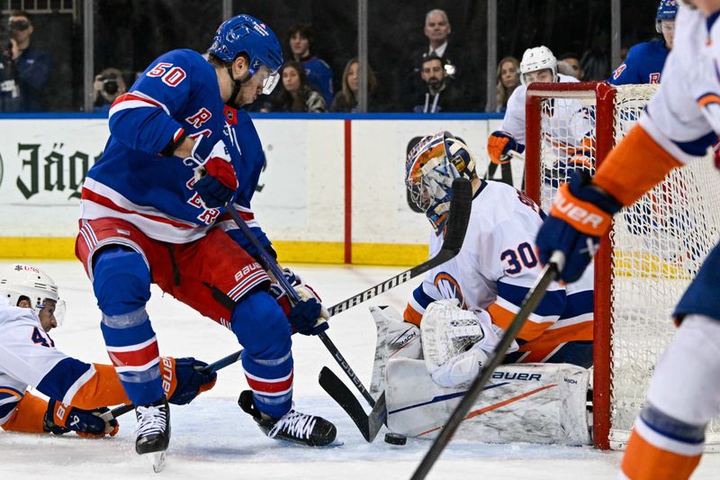 Apr 13, 2024; New York, New York, USA;  New York Islanders goaltender Ilya Sorokin (30) makes a save on New York Rangers left wing Will Cuylle (50) during the second period at Madison Square Garden. Mandatory Credit: Dennis Schneidler-USA TODAY Sports