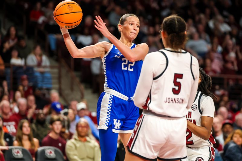 Jan 15, 2024; Columbia, South Carolina, USA; Kentucky Wildcats guard Maddie Scherr (22) passes around South Carolina Gamecocks guard Tessa Johnson (5) in the second half at Colonial Life Arena. Mandatory Credit: Jeff Blake-USA TODAY Sports