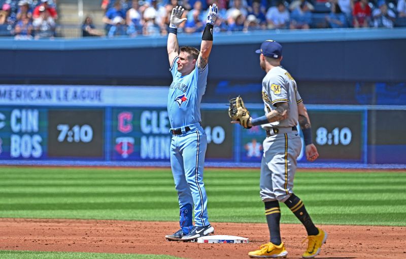 Jun 1, 2023; Toronto, Ontario, CAN;   Toronto Blue Jays catcher Tyler Heineman (55) reacts after hitting a double against the Milwaukee Brewers in the fourth inning at Rogers Centre. Mandatory Credit: Dan Hamilton-USA TODAY Sports