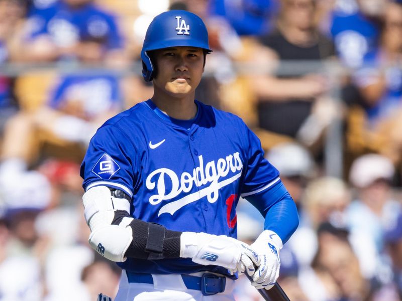 Mar 3, 2024; Phoenix, Arizona, USA; Los Angeles Dodgers designated hitter Shohei Ohtani against the Colorado Rockies during a spring training game at Camelback Ranch-Glendale. Mandatory Credit: Mark J. Rebilas-USA TODAY Sports