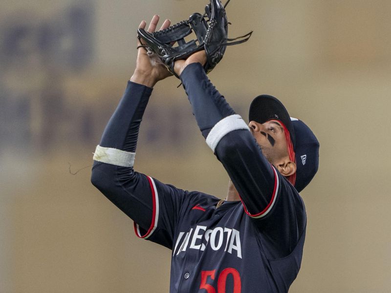 Apr 22, 2024; Minneapolis, Minnesota, USA; Minnesota Twins shortstop Willi Castro (50) catches a fly ball against the Chicago White Sox in the ninth inning at Target Field. Mandatory Credit: Jesse Johnson-USA TODAY Sports