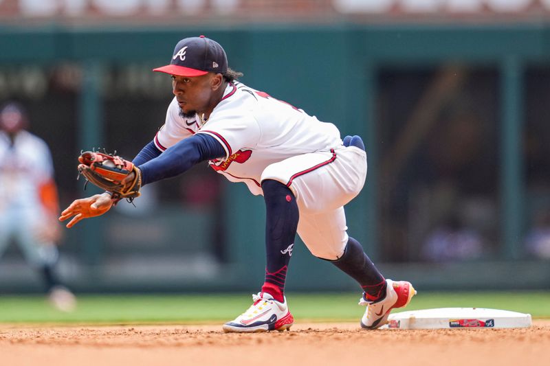 Jun 28, 2023; Cumberland, Georgia, USA; Atlanta Braves second baseman Ozzie Albies (1) catches a throw from the outfield to complete a double play against the Minnesota Twins during the seventh inning at Truist Park. Mandatory Credit: Dale Zanine-USA TODAY Sports