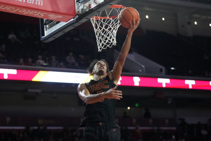 Dec 4, 2024; Los Angeles, California, USA; Southern California Trojans forward Saint Thomas (0) shoots against the Oregon Ducks in the first half at Galen Center. Mandatory Credit: Kirby Lee-Imagn ImagesDec 4, 2024; Los Angeles, California, USA; at Galen Center. Mandatory Credit: Kirby Lee-Imagn Images