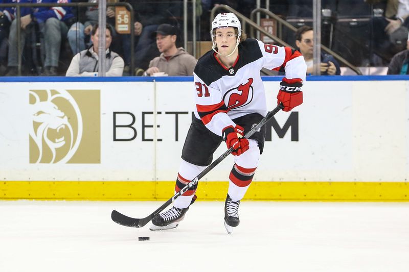 Apr 3, 2024; New York, New York, USA; New Jersey Devils center Dawson Mercer (91) controls the puck in the second period against the New York Rangers at Madison Square Garden. Mandatory Credit: Wendell Cruz-USA TODAY Sports