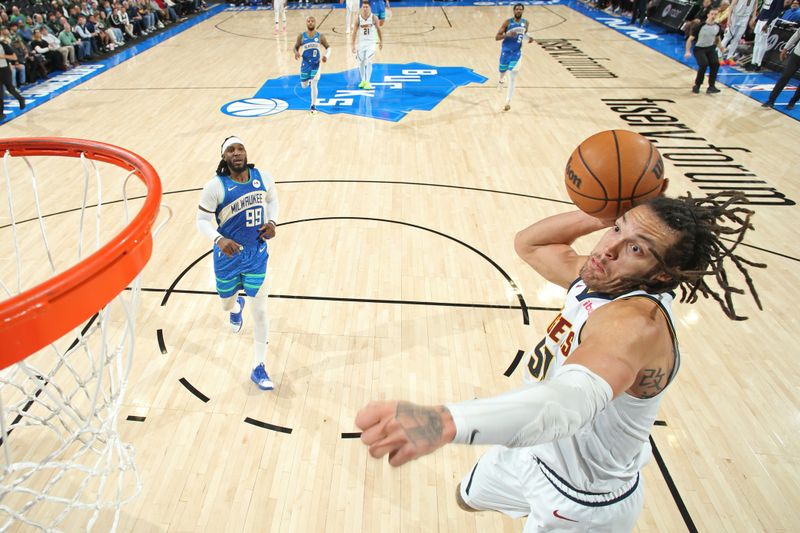 MILWAUKEE, WI - FEBRUARY 12: Aaron Gordon #50 of the Denver Nuggets dunks the ball during the game against the Milwaukee Bucks on February 12, 2024 at the Fiserv Forum Center in Milwaukee, Wisconsin. NOTE TO USER: User expressly acknowledges and agrees that, by downloading and or using this Photograph, user is consenting to the terms and conditions of the Getty Images License Agreement. Mandatory Copyright Notice: Copyright 2024 NBAE (Photo by Gary Dineen/NBAE via Getty Images).