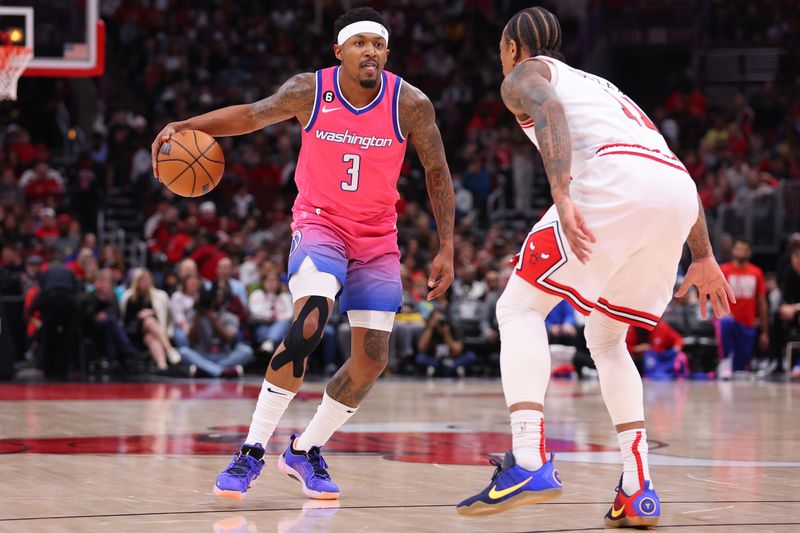 CHICAGO, ILLINOIS - FEBRUARY 26: Bradley Beal #3 of the Washington Wizards dribbles against DeMar DeRozan #11 of the Chicago Bulls during the first half at United Center on February 26, 2023 in Chicago, Illinois. NOTE TO USER: User expressly acknowledges and agrees that, by downloading and or using this photograph, User is consenting to the terms and conditions of the Getty Images License Agreement.  (Photo by Michael Reaves/Getty Images)