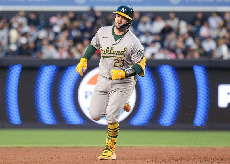 Apr 23, 2024; Bronx, New York, USA; Oakland Athletics catcher Shea Langeliers (23) runs the bases after hitting a solo home run during the second inning against the New York Yankees at Yankee Stadium. Mandatory Credit: Vincent Carchietta-USA TODAY Sports