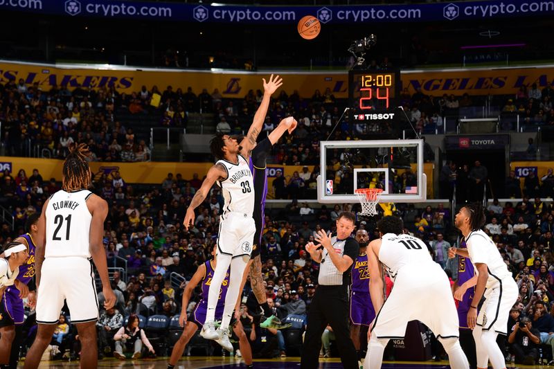 LOS ANGELES, CA - JANUARY 17: Jaxson Hayes #11 of the Los Angeles Lakers and Nicolas Claxton #33 of the Brooklyn Nets go up for the opening tip off on January 17, 2025 at Crypto.Com Arena in Los Angeles, California. NOTE TO USER: User expressly acknowledges and agrees that, by downloading and/or using this Photograph, user is consenting to the terms and conditions of the Getty Images License Agreement. Mandatory Copyright Notice: Copyright 2025 NBAE (Photo by Adam Pantozzi/NBAE via Getty Images)