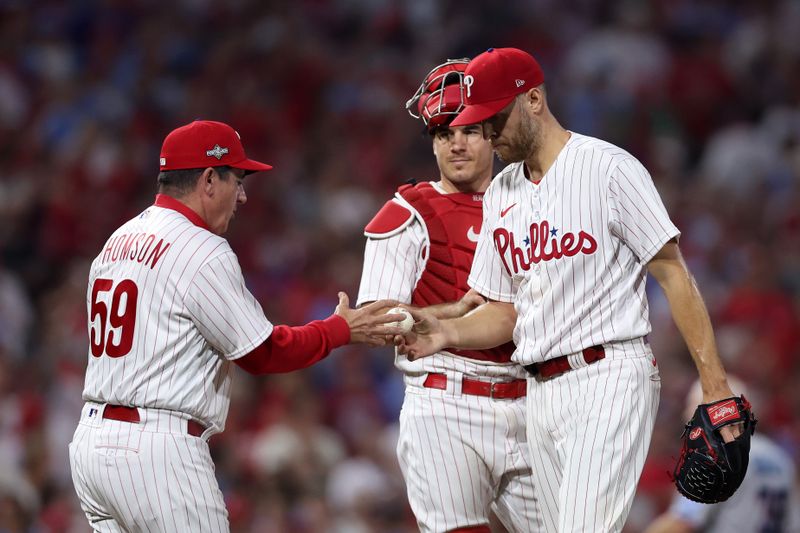 Oct 3, 2023; Philadelphia, Pennsylvania, USA; Philadelphia Phillies manager Rob Thomson (59) takes out starting pitcher Zack Wheeler (45) in the seventh inning for game one of the Wildcard series for the 2023 MLB playoffs against the Miami Marlins at Citizens Bank Park. Mandatory Credit: Bill Streicher-USA TODAY Sports