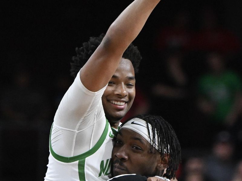 Mar 28, 2023; Las Vegas, NV, USA; North Texas Mean Green guard Tylor Perry (5) celebrates the victory against the Wisconsin Badgers at Orleans Arena. Mandatory Credit: Candice Ward-USA TODAY Sports