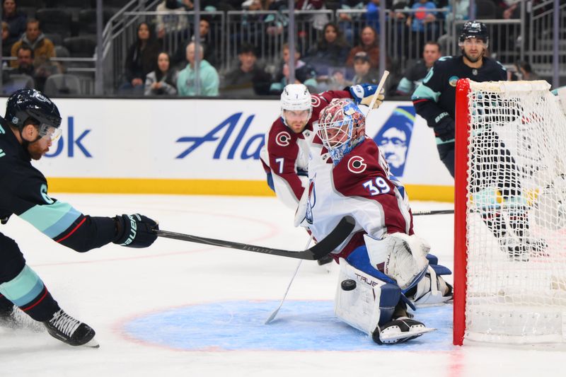 Dec 16, 2025; Seattle, Washington, USA; Colorado Avalanche goaltender Mackenzie Blackwood (39) blocks a goal shot by Seattle Kraken defenseman Adam Larsson (6) during the second period at Climate Pledge Arena. Mandatory Credit: Steven Bisig-Imagn Images