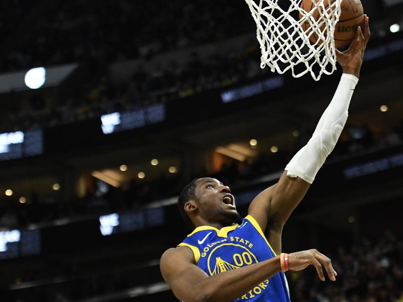 SALT LAKE CITY, UTAH - FEBRUARY 15: Jonathan Kuminga #00 of the Golden State Warriors shoots over John Collins #20 of the Utah Jazz during the first half of a game at Delta Center on February 15, 2024 in Salt Lake City, Utah. NOTE TO USER: User expressly acknowledges and agrees that, by downloading and or using this photograph, User is consenting to the terms and conditions of the Getty Images License Agreement. (Photo by Alex Goodlett/Getty Images)