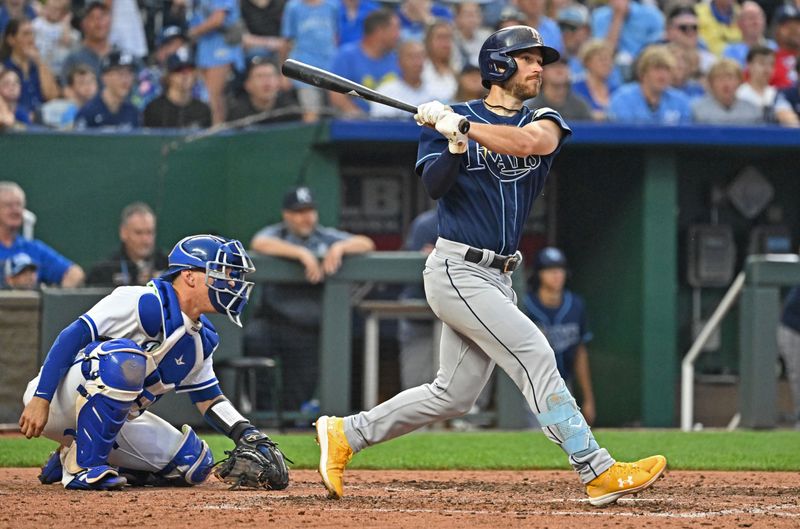 Jul 15, 2023; Kansas City, Missouri, USA;  Tampa Bay Rays second baseman Brandon Lowe (8) doubles against the Kansas City Royals in the ninth inning at Kauffman Stadium. Mandatory Credit: Peter Aiken-USA TODAY Sports